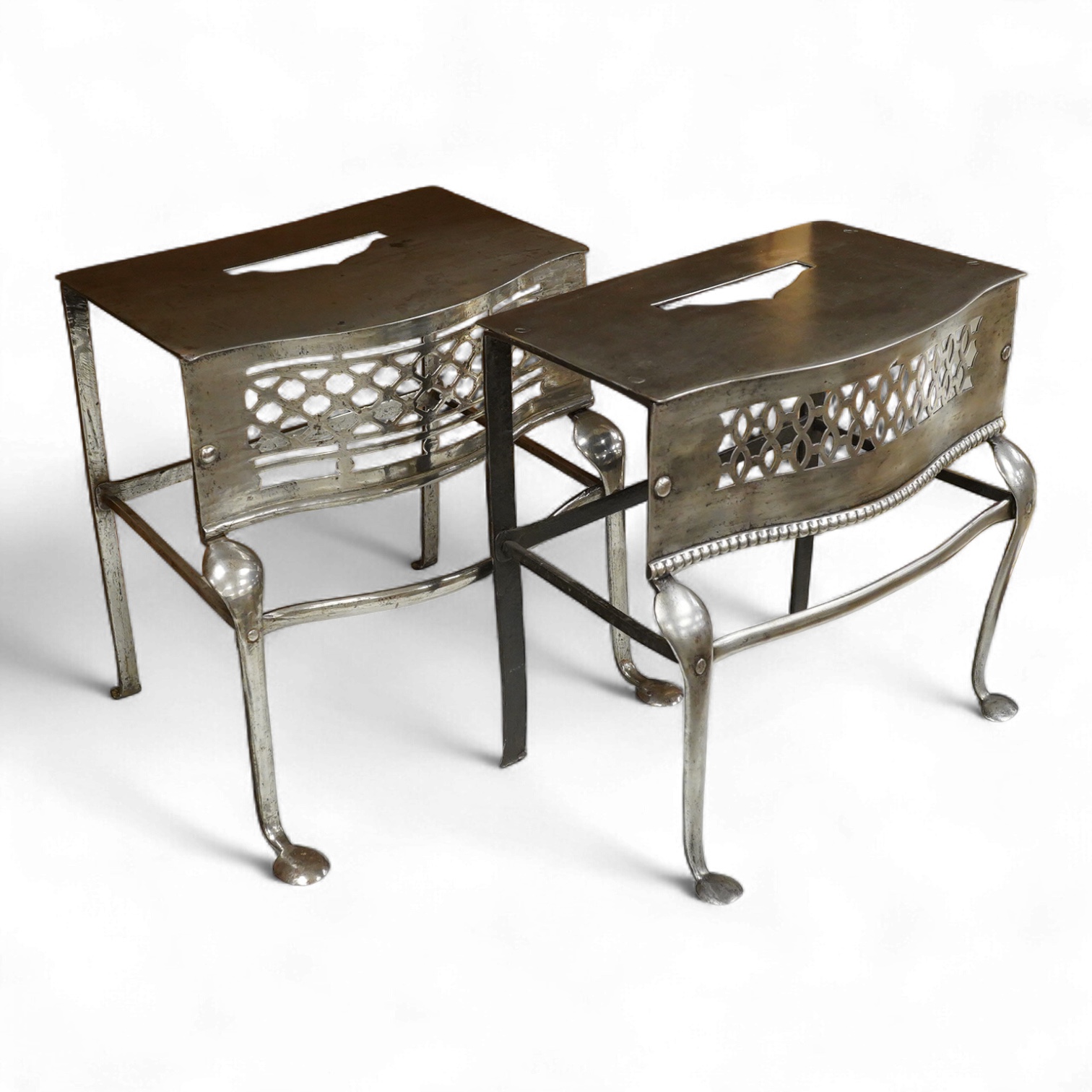 Two late Georgian pierced steel footman, 29cm high